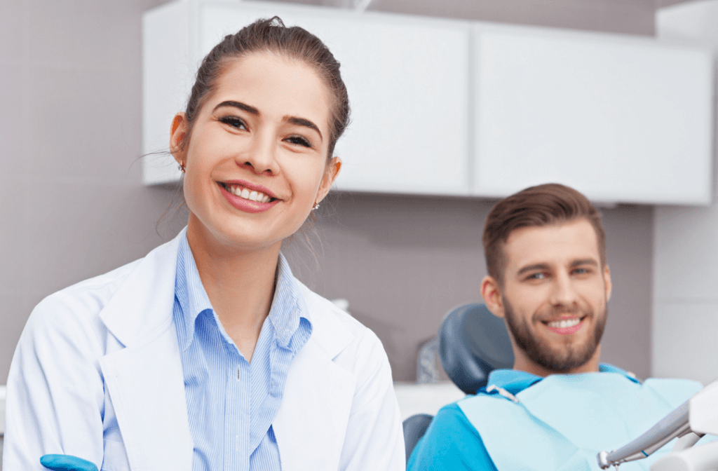 Dentist and patient smiling — Dental Membership Plans